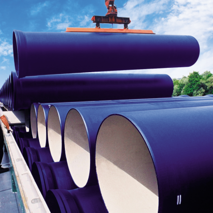 multiple blue pipes on a flatbed truck