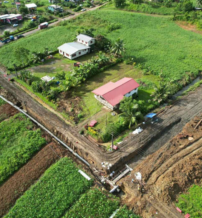 Aerial view of Waila project job site showing trench with pipeline in a rural setting.